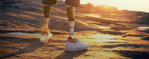 prothesis in the sunset while standing on rocks