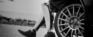 prosthetic legs by a car wheel